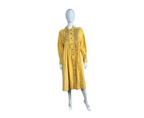 A 1970s hand worked traditional farmers style smock by Flocks and Smocks of Norfolk in mustard yellow with taupe smocking and