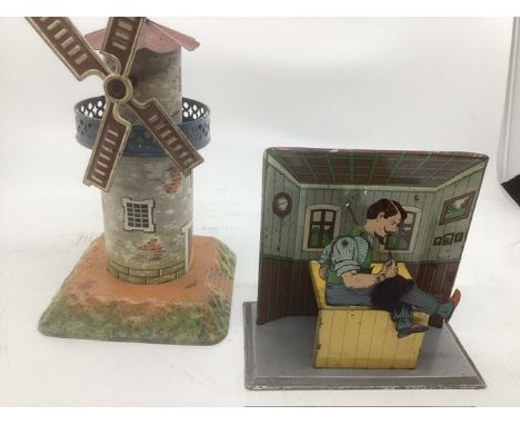 Antique Tin plate toys to include a shell turn tin plate working stitching tailor with a needle seated on a base, and a tin p
