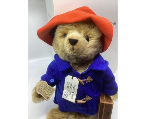   Steiff German boxed Paddington Bear  354250  with blue coat and red hat with a suitcase and toast and box, as sold.  Made i