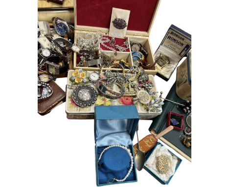 A large collection of vintage costume jewellery and watches including a hinged silver bangle, an antique paste buckle, plasti