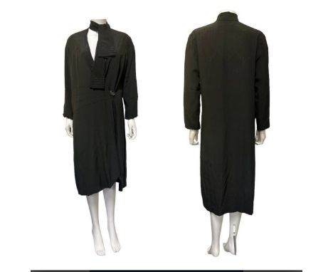 A late 1920s coat in black silk with sunray darts, deco seaming and integral neck scarf, a 50s/60s faux stranded mink fur coa