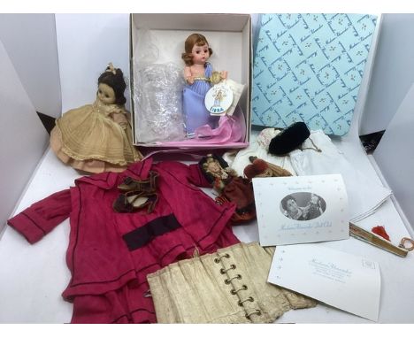 Antique dolls &nbsp;rose dress, and a corset and accessories , together with Madame Alexander pair of vintage dolls and other