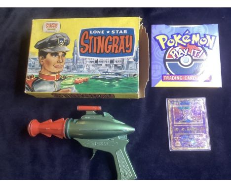 1964 Stingray &nbsp;Gerry Anderson's &nbsp; Lone star gun toy &nbsp;in its original Box together with a Pok&eacute;mon Ancien