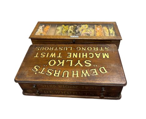 An oak cantilever Haberdashery box dating from the early 20th Century, used as a countertop display in a shop to sell Clark''