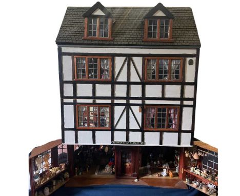 A large Fine extensively furniture Vintage dolls house and antiques shop, fully furnishings and fittings filled and dressed T