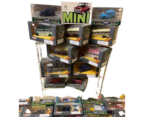 Large collection of 30+ vintaged boxed Corgi diecast toy car vehicles to include Morris Minors, Land Rover and vintage coache