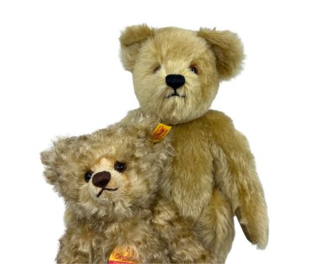 Two vintage bears to include a Steiff 660788 28cm curly mohair bear with wind-up musical box, felted paw pads and yellow tag 