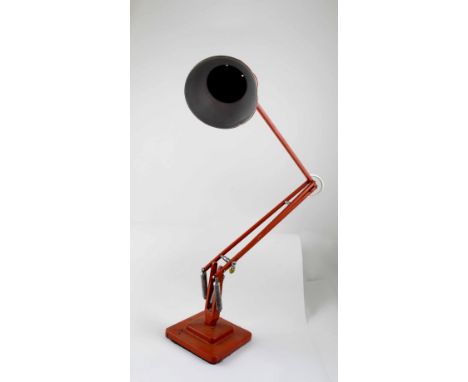 A 20th century painted orange Anglepoise lamp, stamped 'The Anglepoise Patented in UK and Abroad'.