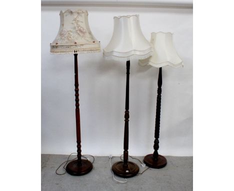 A 1930s oak standard lamp with turned column and two other standard lamps (3). CONDITION REPORT Please note that this lot is 