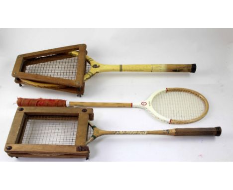A quantity of vintage tennis rackets.