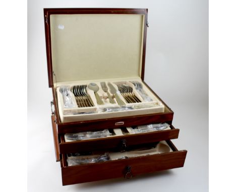 A canteen of Edelstahl Solingen cutlery with gilt-edged handles, to include spoons, knives, forks, teaspoons, soup spoons, to