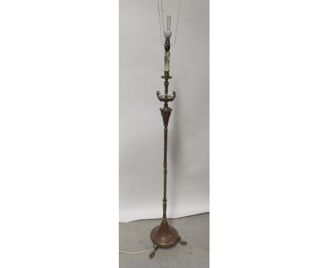 An Empire-style gilt metal standard lamp, with reeded and acanthus leaf column on domed base with paw feet, height 140cm. CON