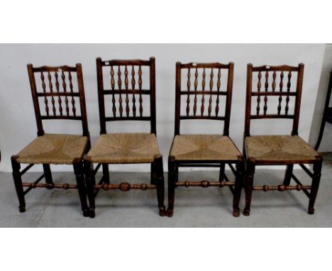 A set of four country-style kitchen chairs with bobbin-turned backs, rush seats, turned cross-stretchers and pad feet (4).