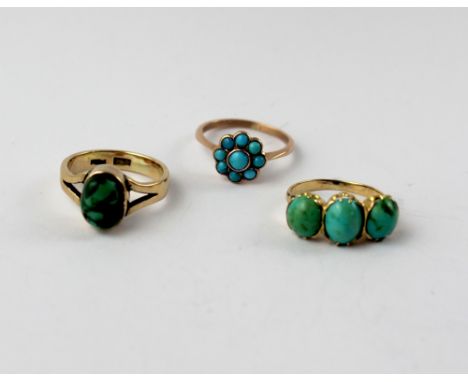 A 9ct gold dress ring set with a single green stone, approx 3.6g, size J1/2, a yellow metal dress ring set with turquoise clu