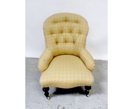 A 19th century mahogany upholstered button-back nursing chair with cream chequered pattern.