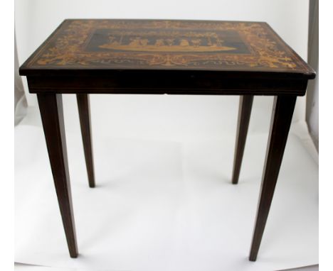 An early 20th century mahogany Italian side table with marquetry inlaid top depicting a country dancing scene, on square tape