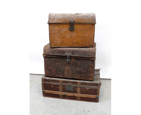 A vintage leather metal-bound travel trunk with wooden slats to the top, width 82cm, height 32cm and two vintage metal travel