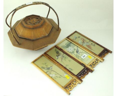 A 19th century Chinese lidded rice carrier of octagonal form, the domed octagonal lid has a recessed carved figure depicting 