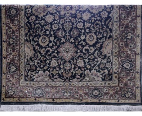 A large contemporary machine made woollen carpet with floral design, 270 x 185cm. CONDITION REPORT Please note that this lot 