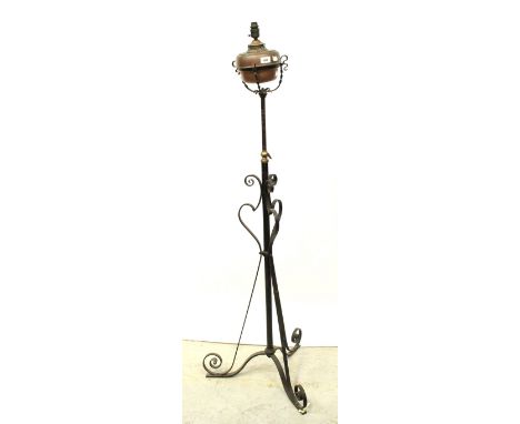 A Victorian copper oil lamp converted to electricity, raised on adjustable black painted cast iron stand, height approx 160cm