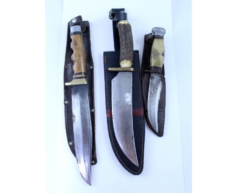 Three collectible vintage hunting knives to include an R Weber Jr, Solingen example, in original leather sheath, length 33cm,