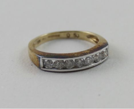 A 9ct yellow gold ring set with seven small diamonds, size M, approx 2.2g.