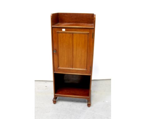 An Edwardian mahogany smoker's cabinet with three-quarter galleried top above single panelled door with fitted interior inclu