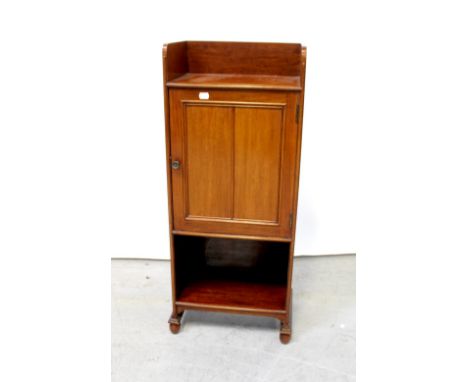 An Edwardian mahogany smoker's cabinet with three-quarter galleried top above single panelled door with fitted interior inclu