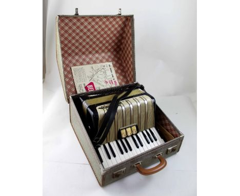 A Hohner Student VM, forty-eight key piano accordion in travel case.