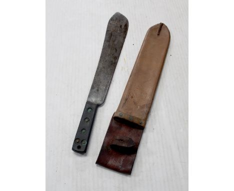 A British military issue machete with scabbard dated 1952. CONDITION REPORT In poor condition.Please note that this lot is no