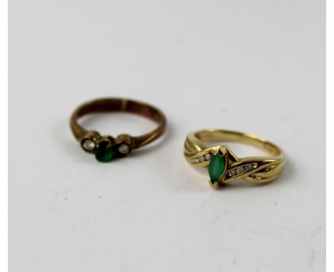 A 9ct gold ring set with and emerald and two small diamonds, size I1/2, and a 9ct gold ring set with an emerald and diamond c