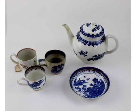 A 19th century Worcester porcelain globular shaped teapot decorated with sprigs of garden flowers in underglaze blue, height 