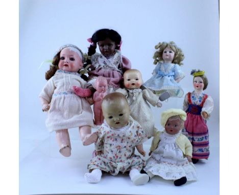 Twelve Antique and vintage dolls of small size to include an Armand Marseille example, P1.214.2, with sleepy eyes and open mo