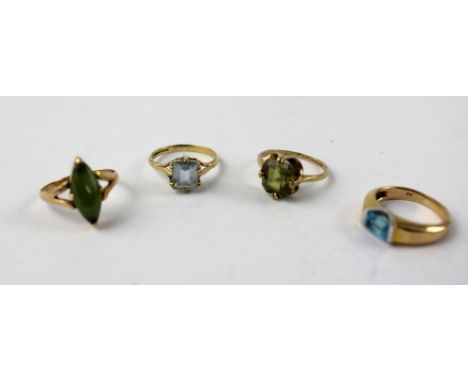 A 9ct gold dress ring set with a blue sapphire, size H, a 9ct gold ring set with pale blue stone, size G, a 9ct gold ring set