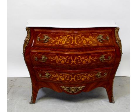 A Louis XV style parquetry veneered and satinwood inlaid bombé-fronted commode with three drawers, white marble top and metal