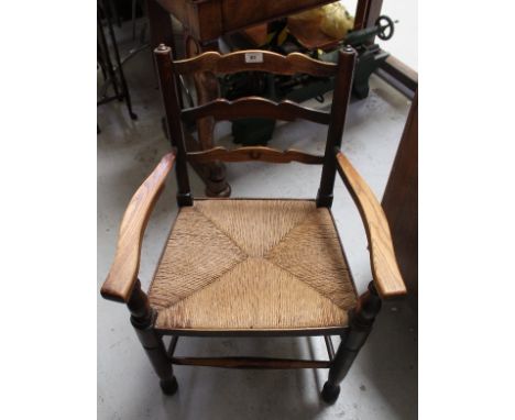 A set of ten (8 + 2) reproduction oak Lancashire-style ladder-back and rush-seated chairs (10).