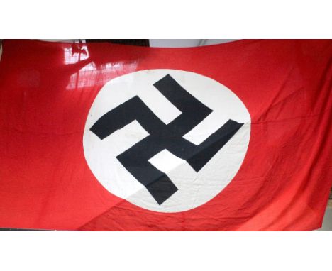 A large red ground, building drape style banner/flag bearing black swastika on white background, marked Reichenburg Sudetenla