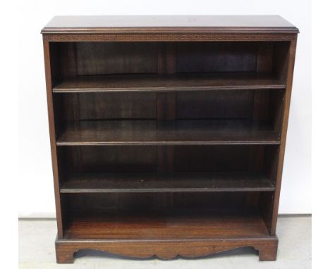 A mahogany floor standing bookcase with carved Greek Key frieze on bracket feet, height 98cm, width 91cm.