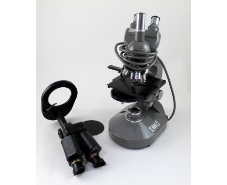 A cased binocular microscope made in USSR and an Olympus, Japan heavy microscope, number 209866, height 41cm.