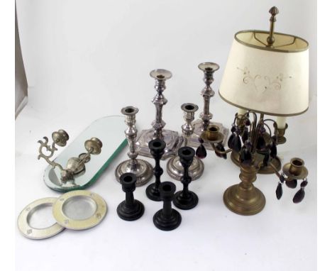 A mixed lot of candlesticks to include two pairs of candlesticks, a chamber stick, various smaller brass and ebonised example