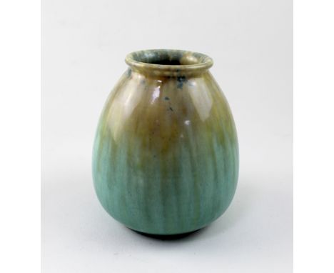 William Howson Taylor for Ruskin Pottery; a high fired vase of tapering cylindrical form covered with a caramel and pale gree