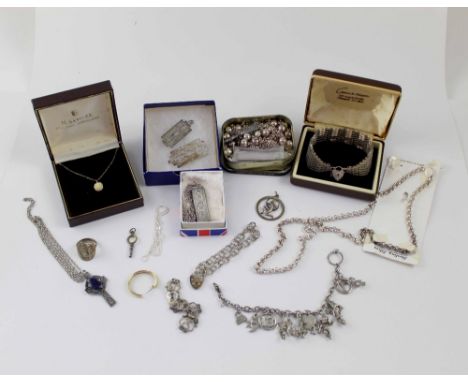 A large mixed group of silver jewellery including charm bracelets, bracelets, pendants, necklaces, silver key (which can be c