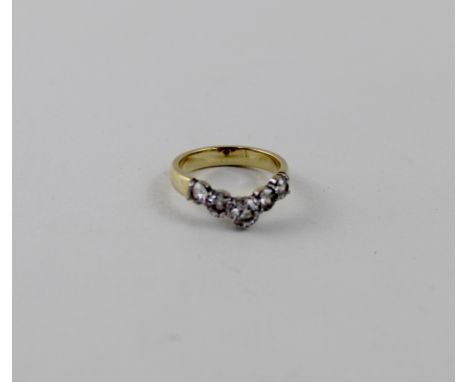 An 18ct gold five-stone wishbone diamond ring with graduated stones, largest brilliant cut diamond approx 0.3ct, size K 1/2, 