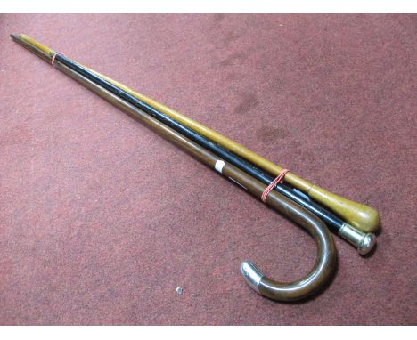 An Early XX Century Walking Stick, with silver mount; a swagger stick with plated mount and another wooden topped example.