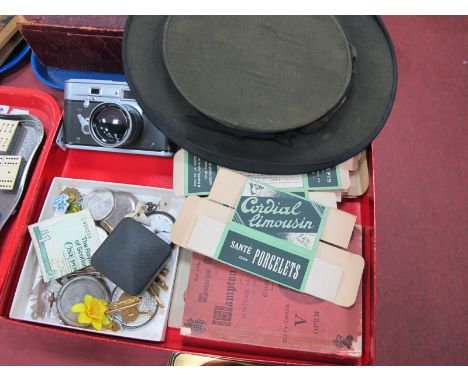 A Pop Up Top Hat, mid XX Century French advertising boxes, fob watch parts, enamel badges etc.