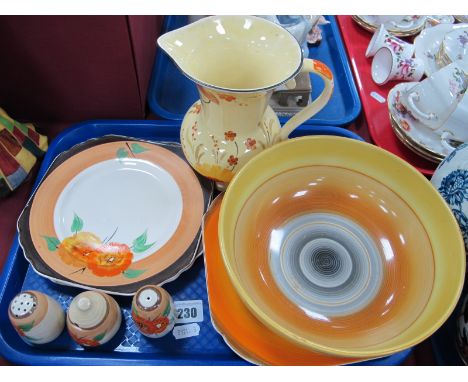 A Clarice Cliff Three Piece Condiment Set, two matching plates, printed mark and Wedgwood stamp, Shelley 'Harmony' bowl and p