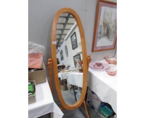 An oval cheval mirror