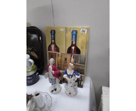 A pair of figures and a quantity of ceramic tiles