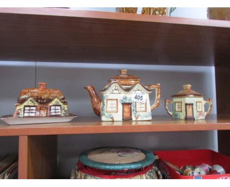 A cottage ware teapot, butter dish and jam pot