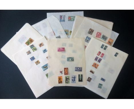 British commonwealth stamp collection on approx. 30 loose album pages. Includes Singapore, South Africa, Kenya, Uganda, Tanga